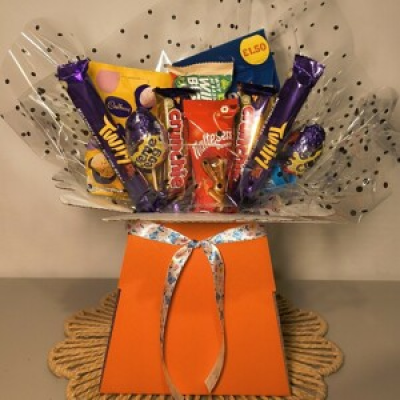 The Chocolate Bouquet - Delight any sweet tooth with this beautifully presented Chocolate Bouquet, packed with a tempting selection of popular chocolate treats.