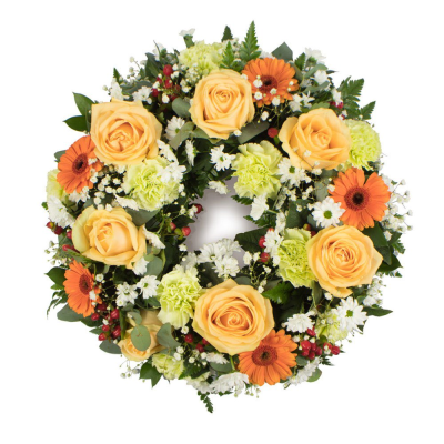 Orange & Peach Wreath Loose - An elegant mixed wreath featuring soft seasonal blooms in Orange and Peach blooms and foliage to create a heartfelt tribute. 

Please note images are examples only, flowers used ma