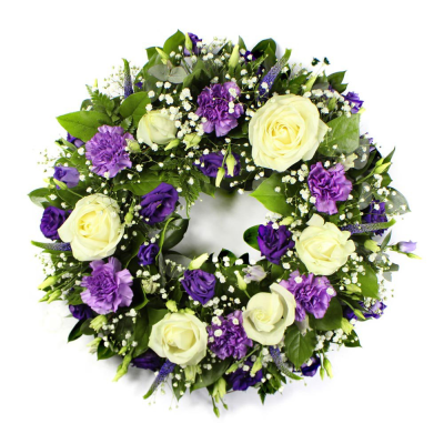 Purple & White Wreath Loose - An elegant mixed wreath featuring soft seasonal blooms in Purple and White blooms and foliage to create a heartfelt tribute. 

Please note images are examples only, flowers used ma