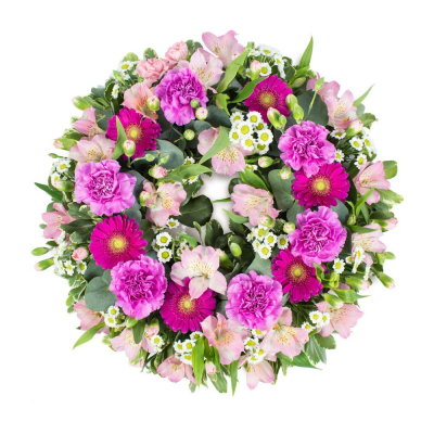 Pink Wreath Loose - An elegant mixed wreath featuring soft seasonal blooms in Pink blooms and foliage to create a heartfelt tribute. 

Please note images are examples only, flowers used may vary due t