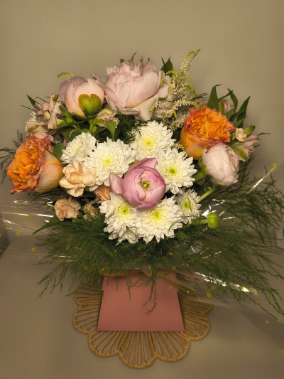 Pastel Promise - A beautifully delicate bouquet featuring soft pinks, peach-toned roses, creamy white blooms, and fresh seasonal foliage. Pastel Promise is filled with gentle colour and timeless charm, making it the perfect gift for birthdays, celebrations, or simply letting someone know you're thinking of them. A graceful arrangement that brings beauty and joy to any occasion. Beautifully wrapped and presented in a water filled gift box.

Please note images are examples only, flowers used may vary due to seasonal availability.