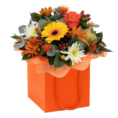 Pumpkin Blossom - Bursting with the rich colours of autumn, Pumpkin Blossom combines vibrant orange blooms, sunny golden tones, seasonal berries, and fresh foliage to create a cheerful and welcoming