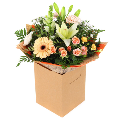 Champagne Wishes - Elegant and timeless, Champagne Wishes features a beautiful blend of creamy lilies, soft peach roses, delicate seasonal blooms, and fresh greenery. Arranged in a stylish gift bag, this sophisticated design is perfect for celebrating life's special moments, offering a touch of luxury and natural beauty for any occasion.

Please note images are examples only, flowers used may vary due to seasonal availability.